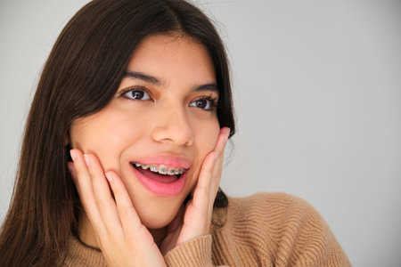 Portrait of a Latin female teenager with dental braces.の写真素材