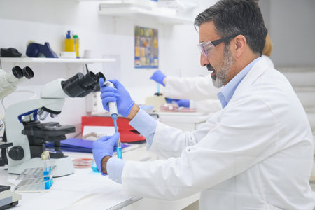 People working on a clinical microbiology laboratory. Scientific research.の写真素材