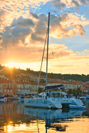 Catamaran in the morning in September 2021 in the harbour of Vela Lucaの写真素材
