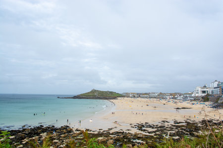 St Ives, Cornwall, UK - August 2023. View of the cliffs and the coast with beach in St. Ives,...