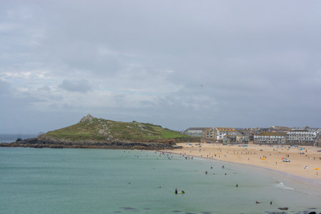 St Ives, Cornwall, UK - August 2023. View of the cliffs and the coast with beach in St. Ives,...