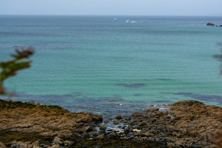 St Ives, Cornwall, UK - August 2023. View of the cliffs and the coast with beach in St. Ives,...
