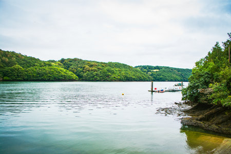River Fal, Cornwall, UK - August 2023: near King Harry Ferry Bridge crossing from Feock to Philleigh. Its vehicular chain ferry.の写真素材