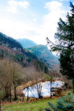 View on the mountains with lake in foreground close to Feldberg, Vorarlberg, Austriaの写真素材