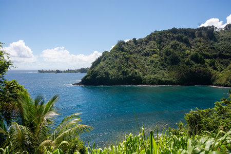 In the middle of the Road to Hana - Hana Highway in the southeast of Maui island, Hawaii - Winding coastal dirt road along the Pacific Oceanの写真素材