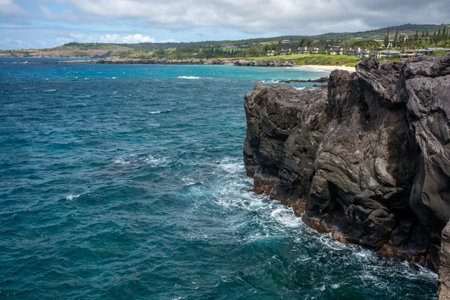 Rugged coastline at the tip of Makaluapuna Point in West Maui, Hawaii - Lava cliffs of Dragon's Point on the Kapalua Coastal Trailの写真素材
