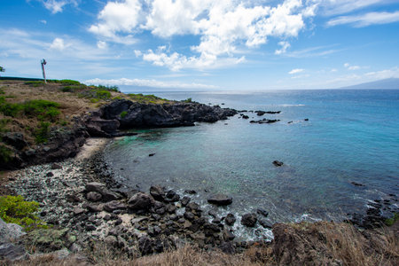Rugged coastline at the tip of Makaluapuna Point in West Maui, Hawaii - Lava cliffs of Dragon's Point on the Kapalua Coastal Trailの写真素材