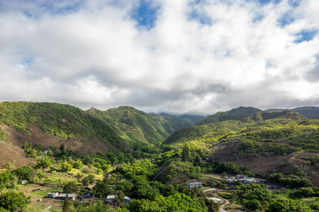 View of a landscape with hills and jungle in West Maui, Hawaii, close to the oceanの写真素材