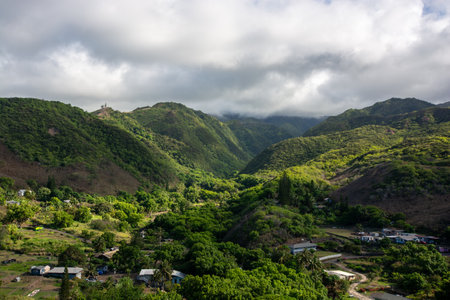 View of a landscape with hills and jungle in West Maui, Hawaii, close to the oceanの写真素材
