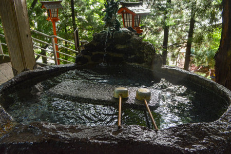 FUJIYOSHIDA, JAPAN -traditional basin at Arakura Sengen Shrine. The shrine is part of Arakurayama Sengen Park, known for Chureito Pagoda and views of Mt. Fuji.の写真素材