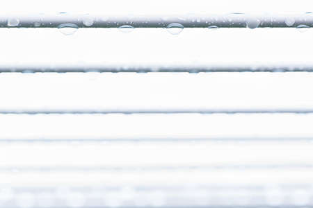 Water drops on a wireの写真素材