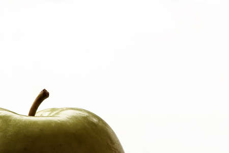 Green apple, shiny refreshing on white backgroundの写真素材