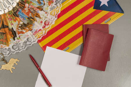 The trip to Catalonia. Copy space. Passports fan flag.の写真素材