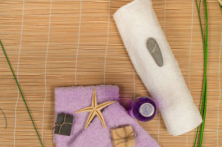 Spa and Wellness setting with natural soap, stones towel Bamboo.の写真素材