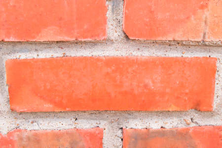 Background of old vintage brick wall, closeup.の写真素材