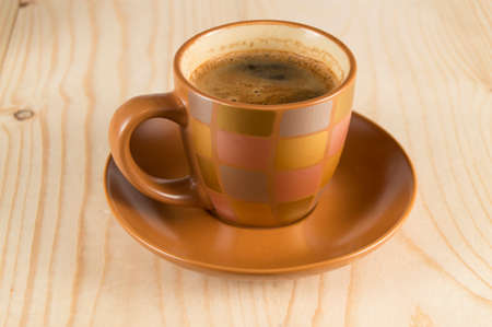 Beautiful brown coffee Cup on wooden background.の写真素材