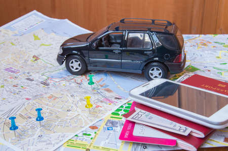 Plan your journey by car, a passport, money, cards mobile phone.の写真素材