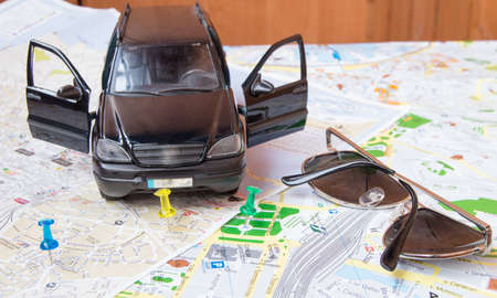 Idea for summer car travel Map with sunglasses, planning the vacationの写真素材