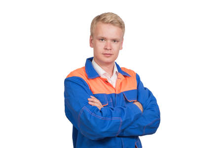 Beautiful portrait of a successful worker in blue uniform isolated on white background.
