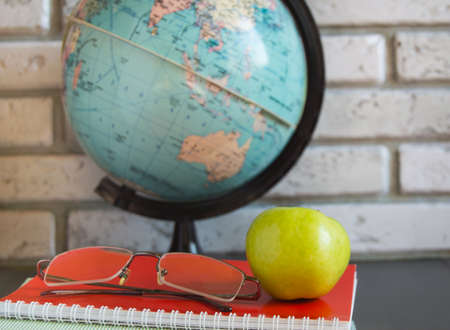 World teachers ' Day in school. Still life with books, globe, Apple glassesの写真素材