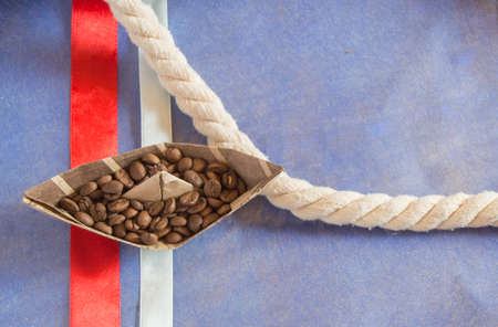 USA holiday, happy Columbus day paper boat on blue background and ribbons decorationsの写真素材