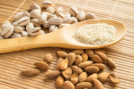 Traditional Indian Pongal, Makar Sankranti almonds pistachios sesame selective focusの写真素材