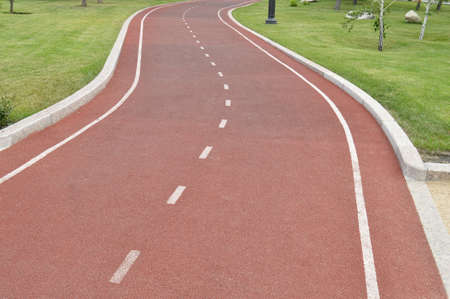 Modern running track in the Park, place for text.