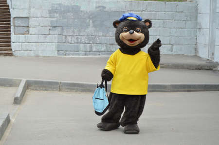 Man in the bear costume in the city, in day of protection of animals, holiday entertainment, advertisingの写真素材