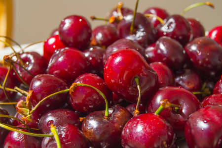 Fresh ripe cherry on a plate, top viewの写真素材