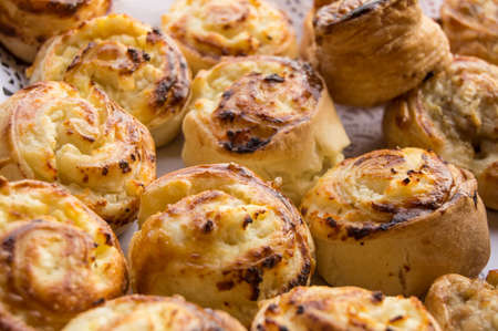 Fresh hot sweet home Baking on paper lace napkin, rolls of buns.の写真素材