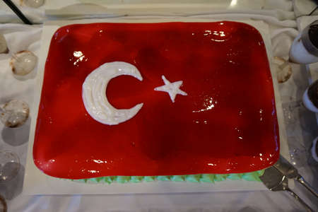 Cake with icing painted Turkish flag, restaurant food concept in the hotelの写真素材