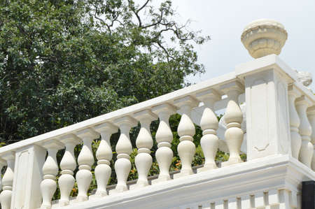 View of the romantic white balcony, terrace with balusters, white stone railing.の写真素材