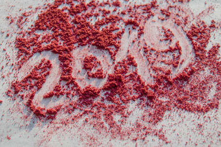 Crushed blush and powder in fashionable bright colors on white background. The inscription 2019.の写真素材