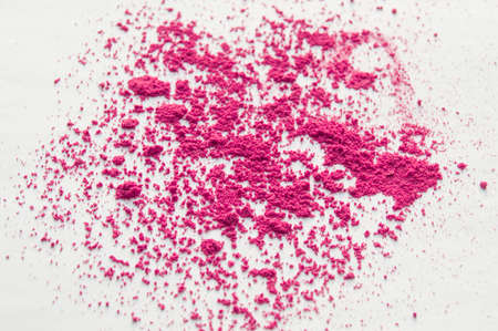 Pink blush scattered on white background, makeup background.の写真素材