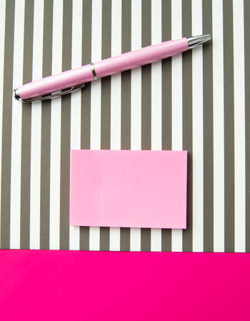 Flat lay, top view office workplace background. Black and white stripes, stickers, fountain pen.の写真素材