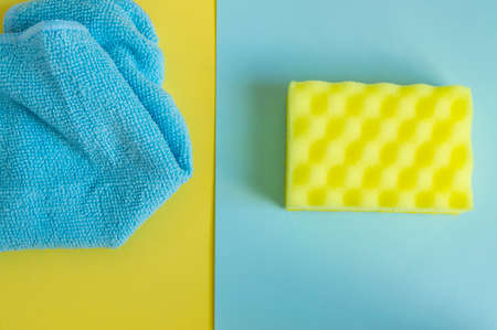 Flat lay, top view. Detergents and cleaners yellow and blue. The concept of cleaning.の写真素材