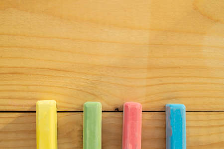 School supplies colored crayons on a light background of the Board stationery. Back to school, the concept of minimalism, flat lay, copyspace.の写真素材