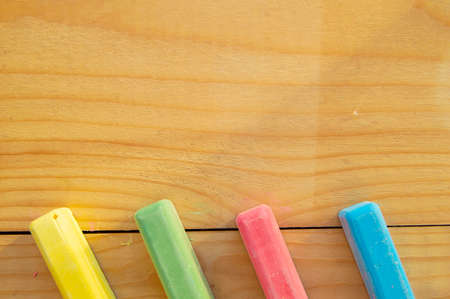 School supplies colored crayons on a light background of the Board stationery. Back to school, the concept of minimalism, flat lay, copyspace.の写真素材