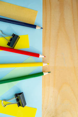 Empty space for text and stationery on wooden background. Layout for design, flat lay, vertical frame.の写真素材