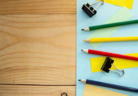 Blank space for text and stationery on wooden background. The layout for the design, flat lay.