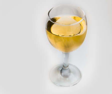 White wine in glass glass on white background.の写真素材