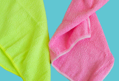 Microfiber cloths isolated on blue background, tools for cleaning and cleanliness. The concept of...