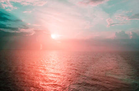 Beautiful view from the deck of the cruise ship at sunrise and the Mediterranean sea, pink and blue tinted .の写真素材