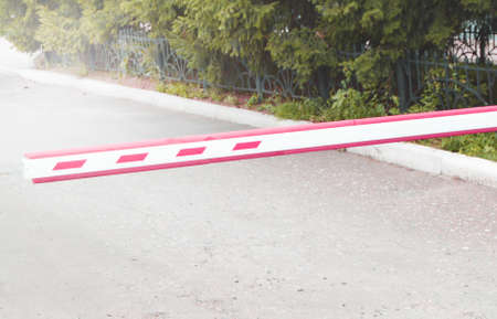 Automatic gate - gate, on the background of a summer day in the city, security system, a place for...