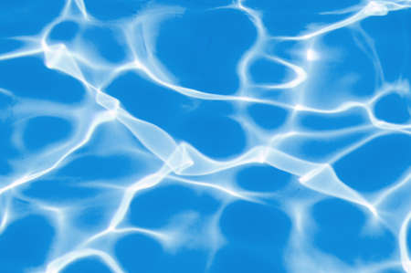 Blue water in the pool water ripple detail abstract background.