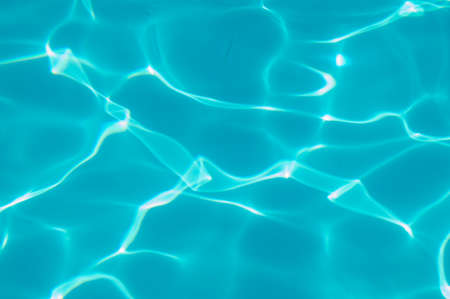 Blue water in the pool water ripple detail abstract background.