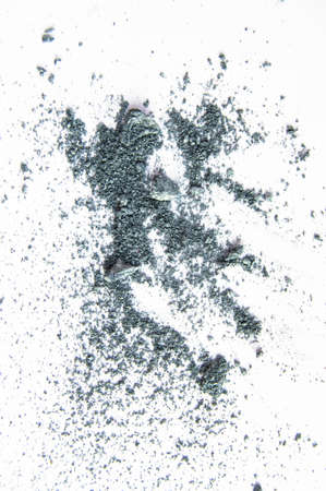 Eye shadow, makeup cosmetics, crushed crumb gray, shiny texture, isolated on white background, vertical shot.の写真素材