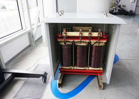 Transformer with electric motor coil, in modern production room.