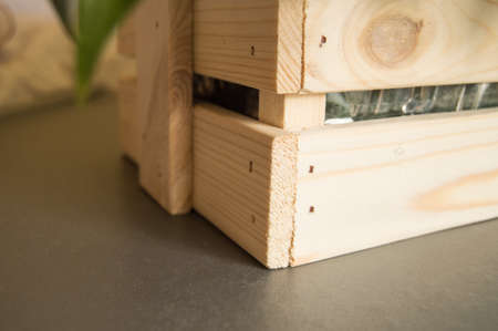 A box of wood for FLOWER ARRANGEMENT STANDS on the table, preparing flowers and bouquets in a floral boutique.の写真素材