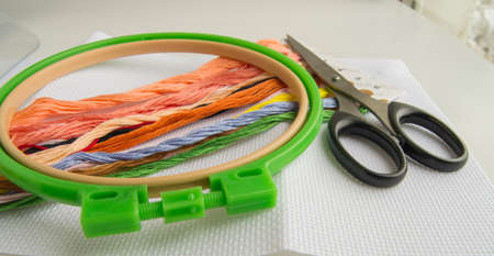 The concept of needlework. Sewing accessories for embroidery-canvas, Hoop, thread floss.の写真素材